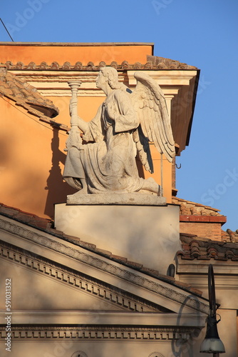 San Rocco all'Augusteo Church Facade Close Up with Sculpted Kneeling Angel in Rome, Italy