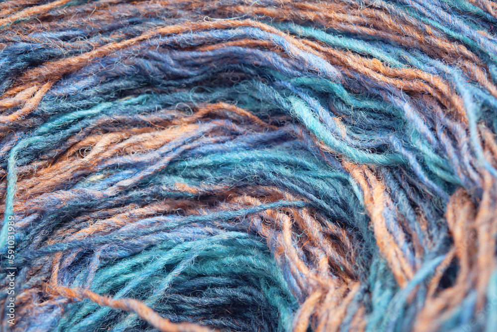 Colorful section-dyed organic lambswool ball. Close-up.