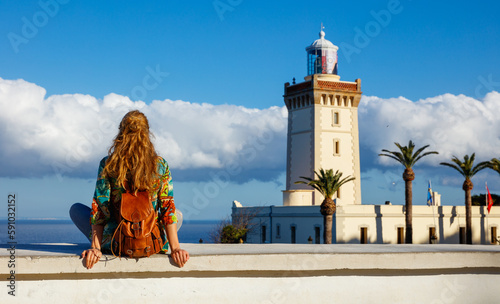 tourism in Morocco-woman tourist looking at cap spartel,  tanger photo