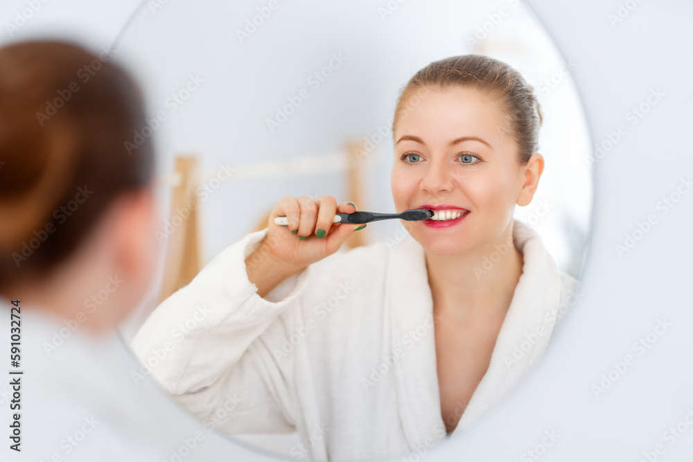 woman brushing  teeth