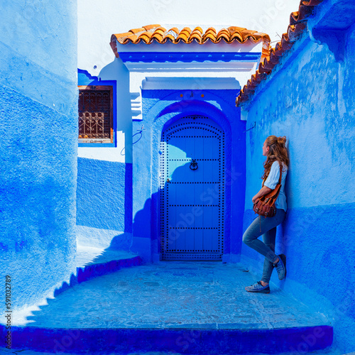 tourism in Morocco-Woman tourist in beautiful blue street in Chefchaouen © M.studio