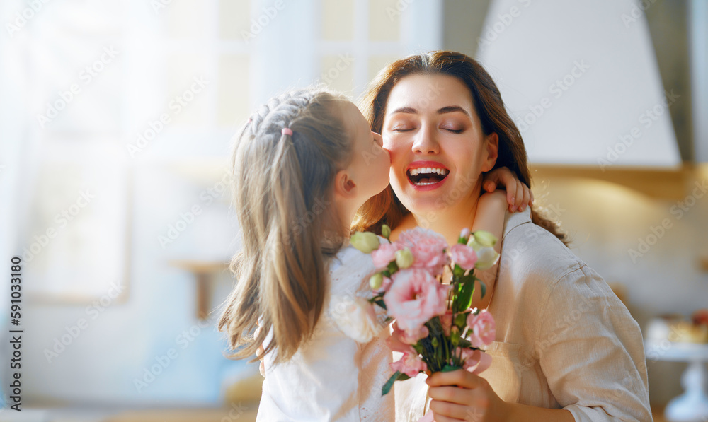 Daughter giving mother bouquet of flowers. Daughter giving mother bouquet of flowers.