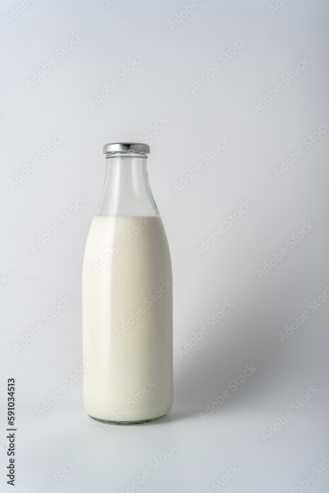 milk in glass bottle Isolated on white background