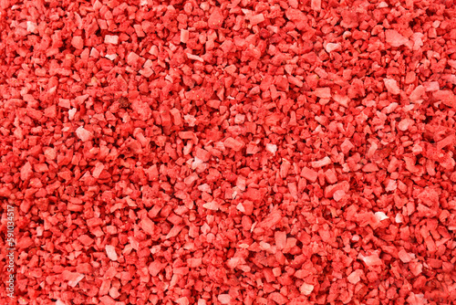 Strawberry food background. Strawberries texture. dehydrated, dried Strawberry pieces, coarse cuts, chips. Heap of freeze dried strawberries. sweet fruit background. Red background stock image.