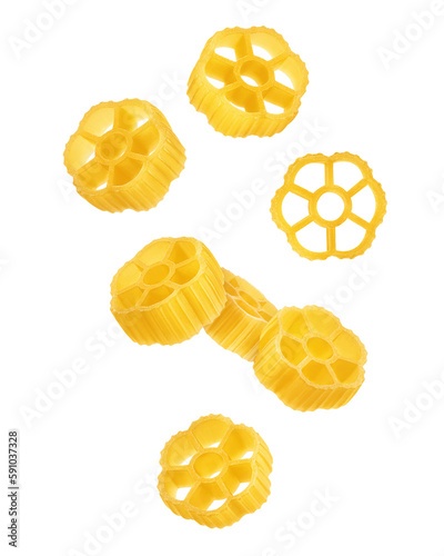 Falling raw Rotelle, uncooked Italian Pasta, isolated on white background, full depth of field photo