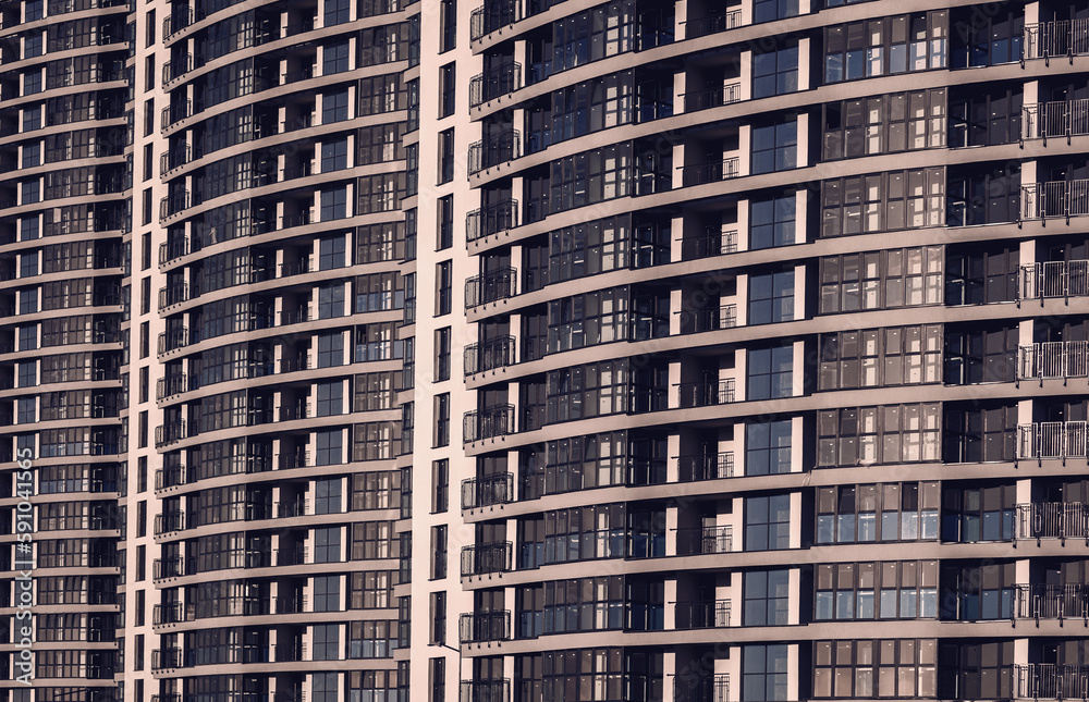 Modern residential building with many windows. Modern residential building with many windows.