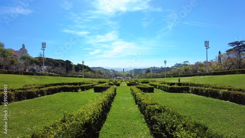 Classic view on a sunny day from Parque Eduardo VII down to the Tagus River in Lisbon, Portugal. Filmed in 4K