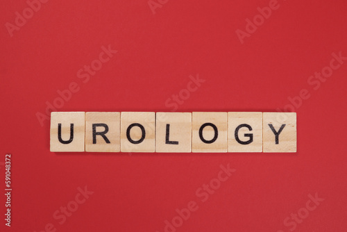 Word Urology from wooden letters on red background