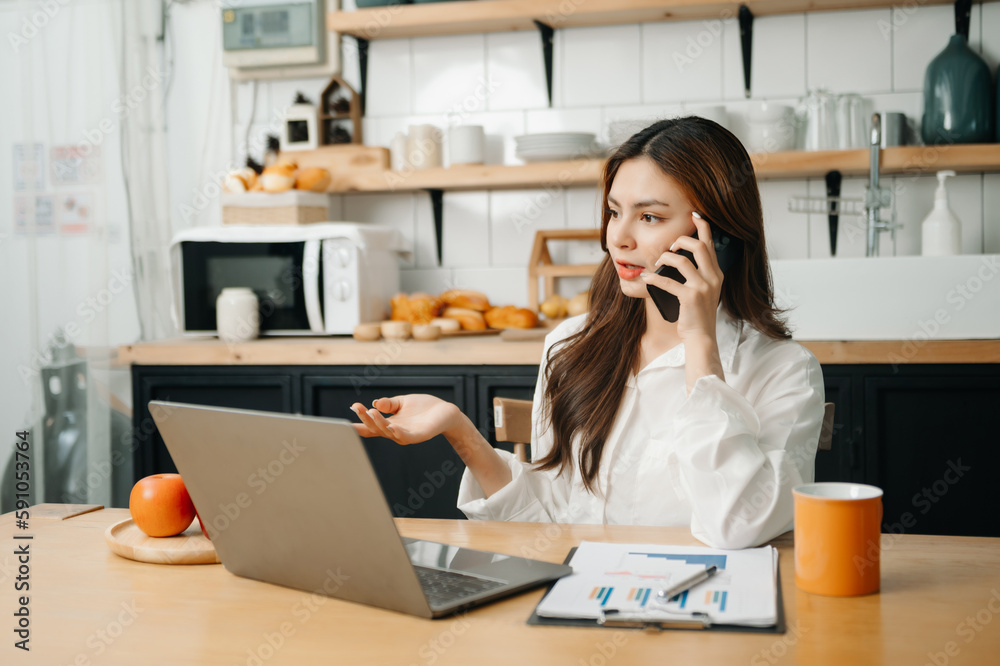 Happy asian business woman have the joy of talking on the smartphone, tablet and laptopon the modern office Happy asian business woman have the joy of talking on the smartphone, tablet and laptopon the modern office