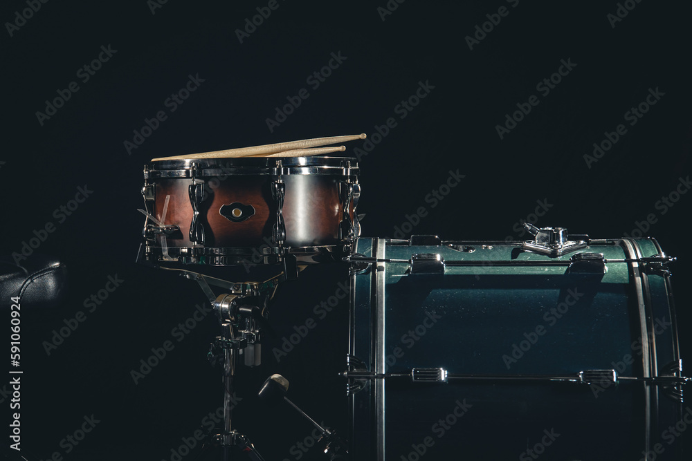 Drum kit on a black background close-up.