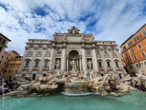 Trevi fountain in Rome, Italy against the cloudy sky