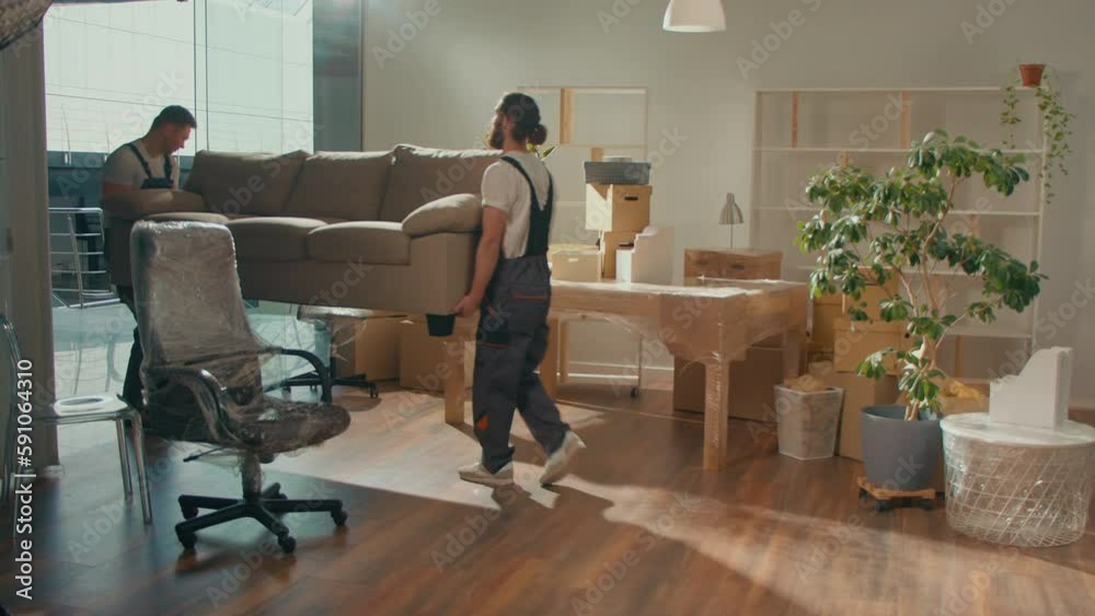 Workers of Moving Company With Uniforms Carefully Packing Furniture. Furniture and Equipment Disassembly and Assembly. Travel insurance. Team of Employee Workers Helps Customers to Relocation. Workers of Moving Company With Uniforms Carefully Packing Furniture. Furniture and Equipment Disassembly and Assembly. Travel insurance. Team of Employee Workers Helps Customers to Relocation.