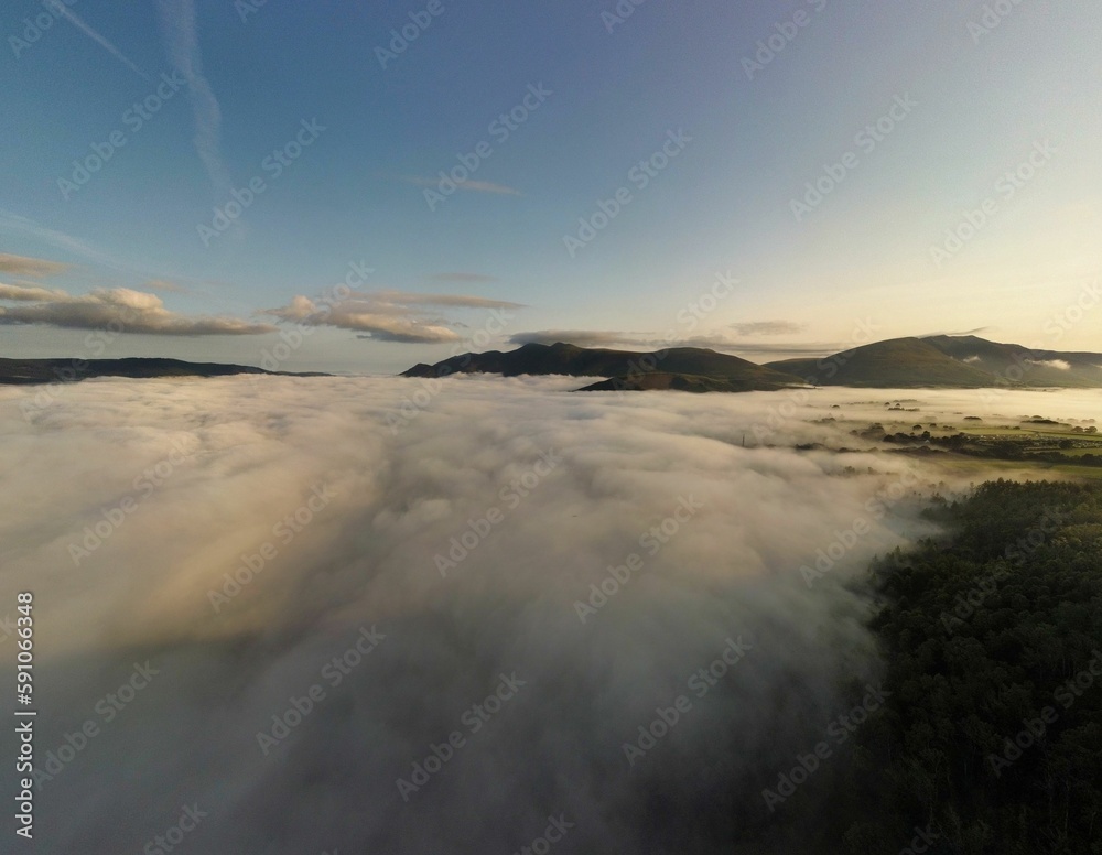 Aerial drone shot of the stacks of clouds in the mountains Aerial drone shot of the stacks of clouds in the mountains