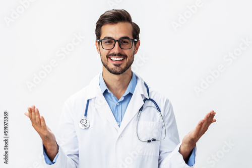 A man doctor in a white coat and eyeglasses with a smile with teeth on a white isolated background looking into the camera  copy space  text space  health