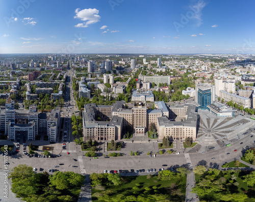 Aerial city panorama view on Karazin National University northern building with green park and blue sky in spring Kharkiv, Ukraine © Kathrine Andi