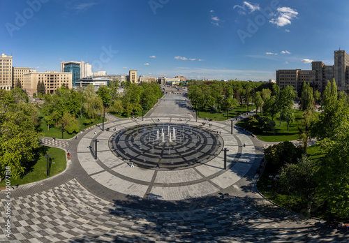 Aerial Freedom (Svobody) Square with a circle fountain in spring city. Kharkiv, Ukraine