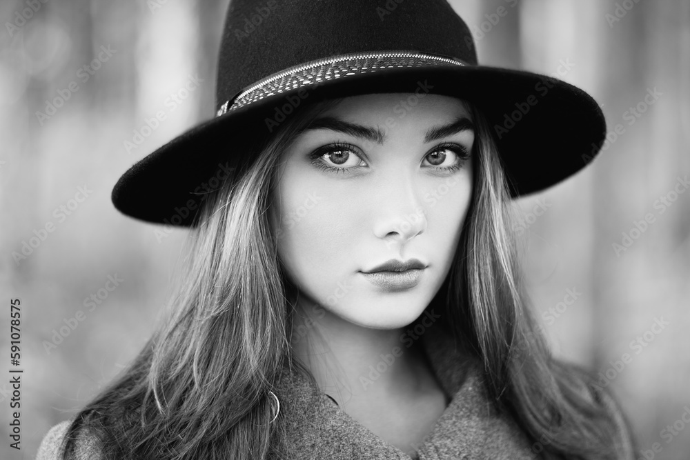 Portrait of young beautiful woman in autumn coat. Girl in hat. Fashion photo