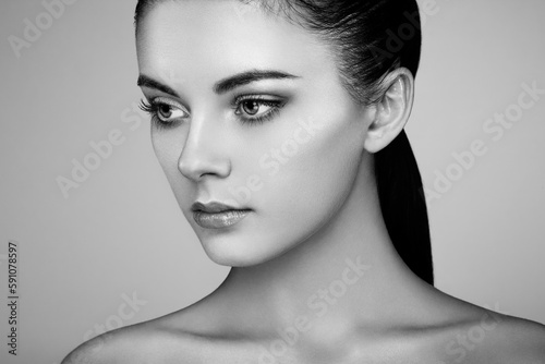 Beautiful woman face. Perfect makeup. Beauty fashion. Eyelashes. Cosmetic Eyeshadow. Highlighting. Black and white