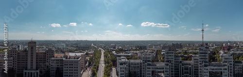 Aerial panorama view on street between Karazin National University and Derzhprom with cars driving to Freedom Square in sunny Kharkiv, Ukraine