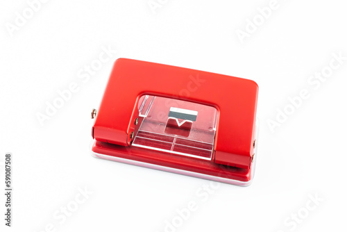 Red paper hole puncher, isolated on white background.
