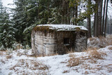 Winter scenery with an abandoned concrete bunker in forest. Velka Destna, Czech republic