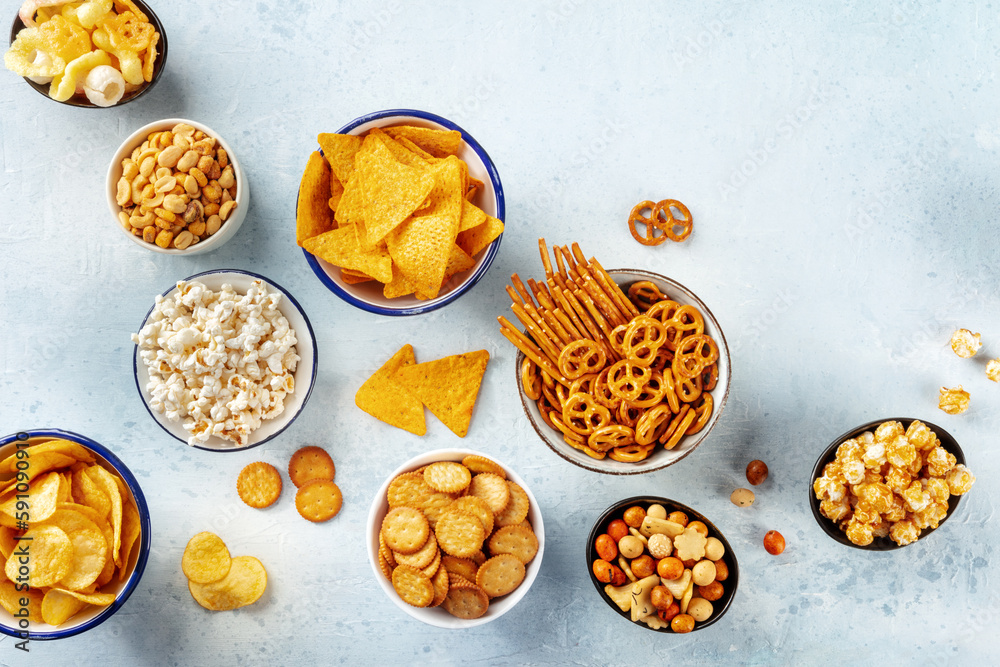 Salty snacks, party mix, overhead flat lay shot. An assortment of appetizers. Potato and