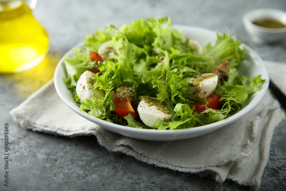 Healthy green salad with mozzarella and tomatoes Healthy green salad with mozzarella and tomatoes
