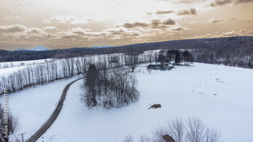 Flying over the cherry river in the Estrie region in winter in Quebec