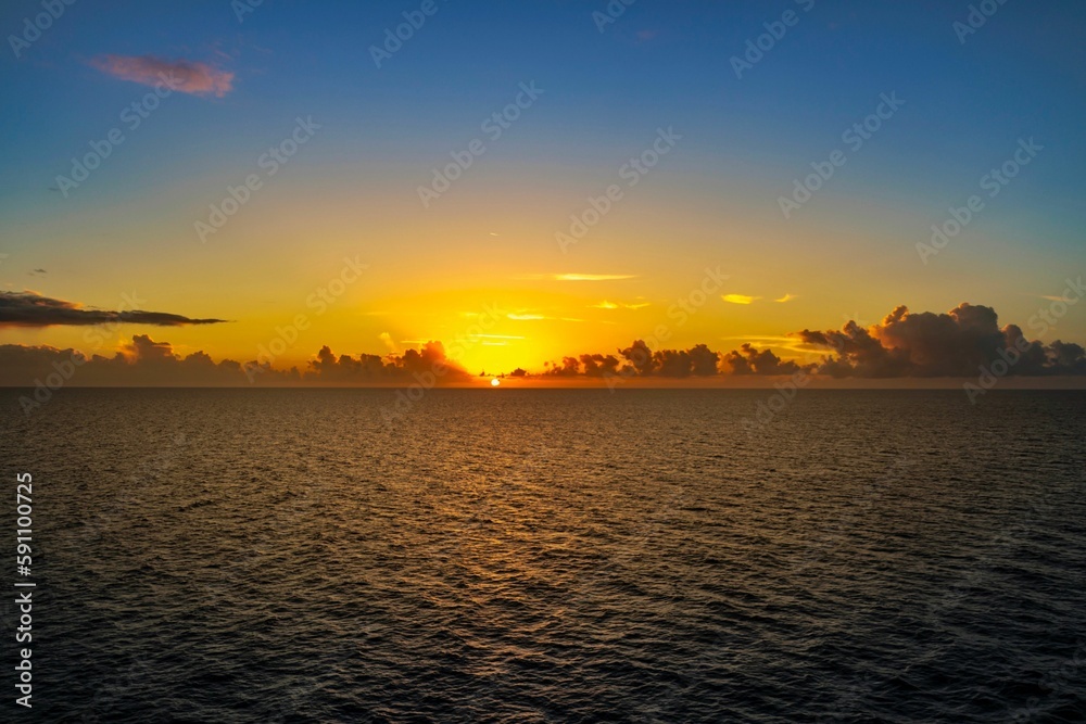 Scenic orange sunset over the calm sea