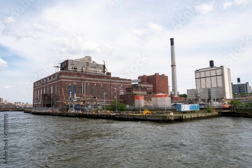 Daytime view of an old power station under cloudy sky in Manhattan, New York City, USA