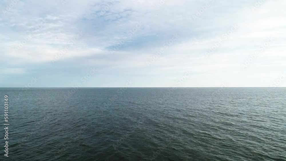 Open ocean blue water on a sunny cloudy summer day on Atlantic Ocean drone moving forward Open ocean blue water on a sunny cloudy summer day on Atlantic Ocean drone moving forward