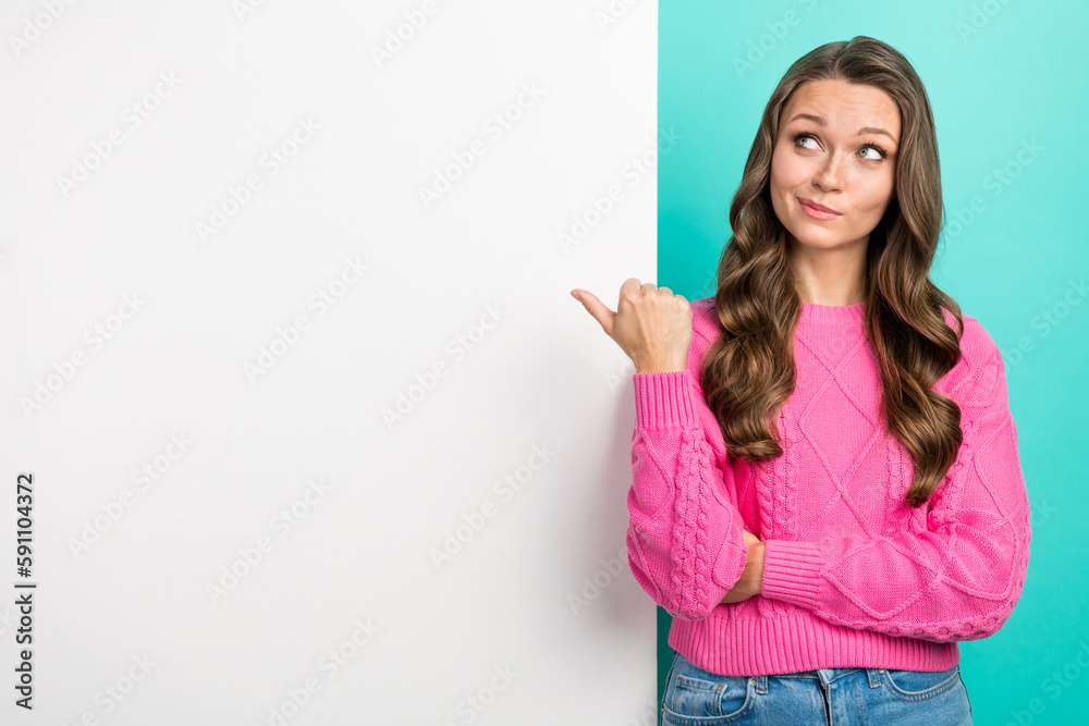 Photo of dreamy unsure girl wear pink sweater looking showing thumb poster empty space isolated turquoise color background Photo of dreamy unsure girl wear pink sweater looking showing thumb poster empty space isolated turquoise color background