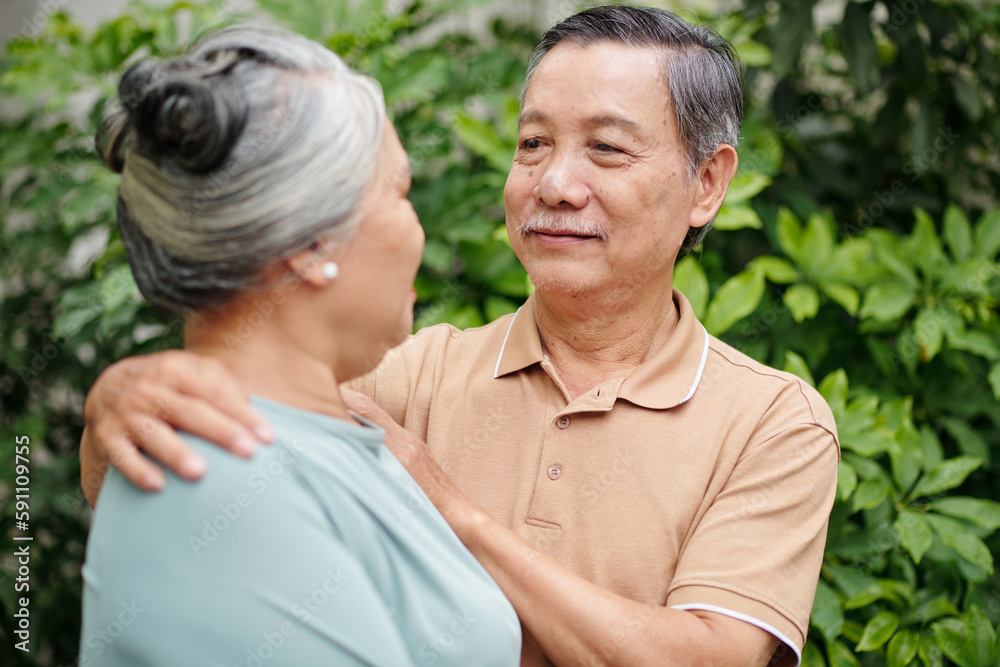 Senior man hugging wife and looking in her eyes Senior man hugging wife and looking in her eyes