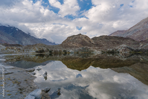 mountains, clouds and sky are  reflected on the lake. Beautiful scenery at Yarab Tso valley - Leh Ladakh - India © Nhan