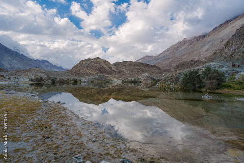 mountains, clouds and sky are  reflected on the lake. Beautiful scenery at Yarab Tso valley - Leh Ladakh - India © Nhan