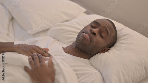 African Man Waking Up and Leaving Bed