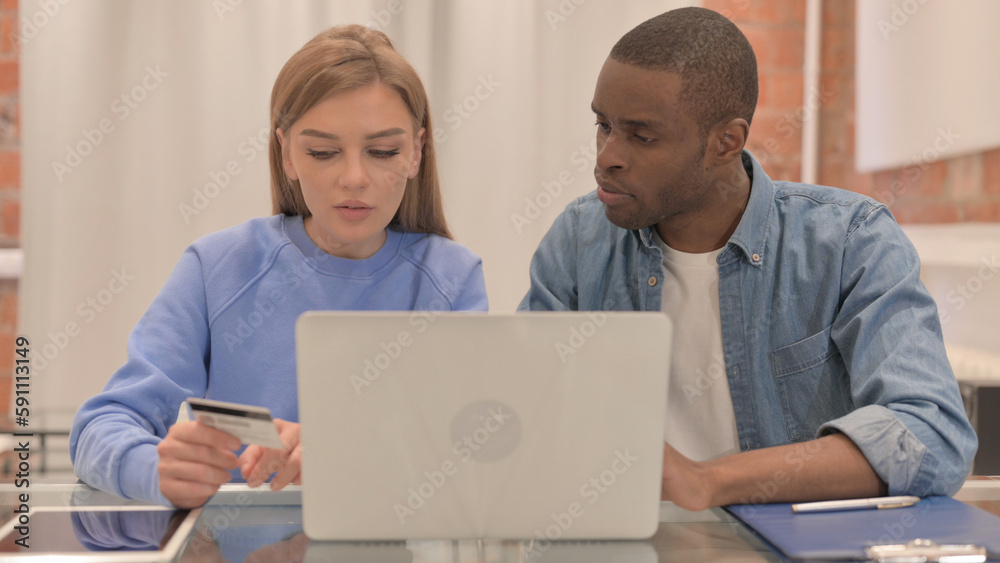 Interracial Couple Happy for Successful Online Shopping on Laptop Interracial Couple Happy for Successful Online Shopping on Laptop