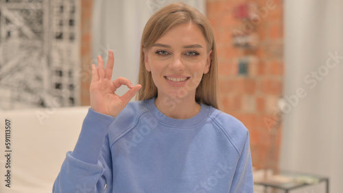 Free Download Portrait of Young Woman Doing Ok Sign - GFXLoad