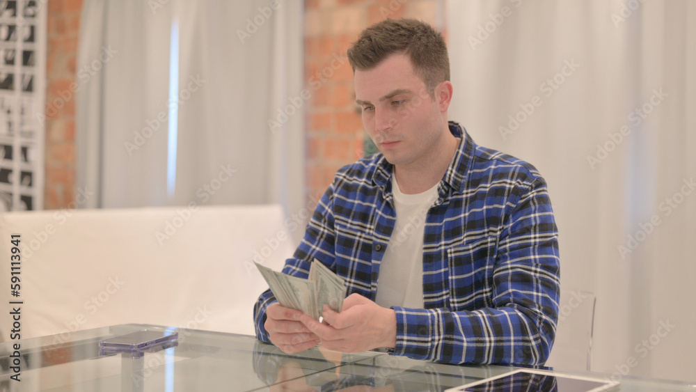 Young Casual Man Counting Dollars, Money Making Young Casual Man Counting Dollars, Money Making