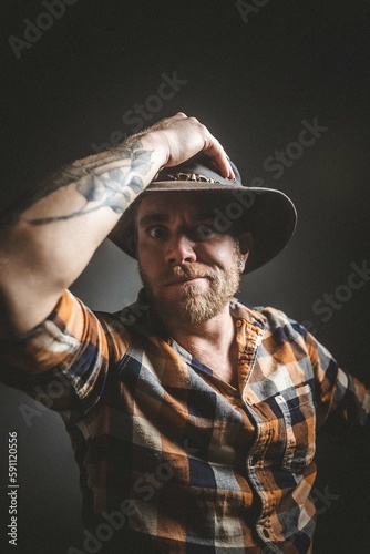 Australian man in outback cowboy hat.  Studio session.