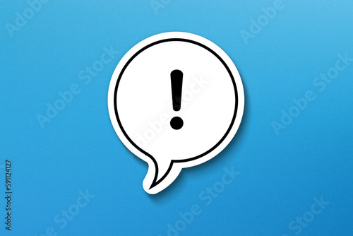 Exclamation mark with speech bubble on blue background