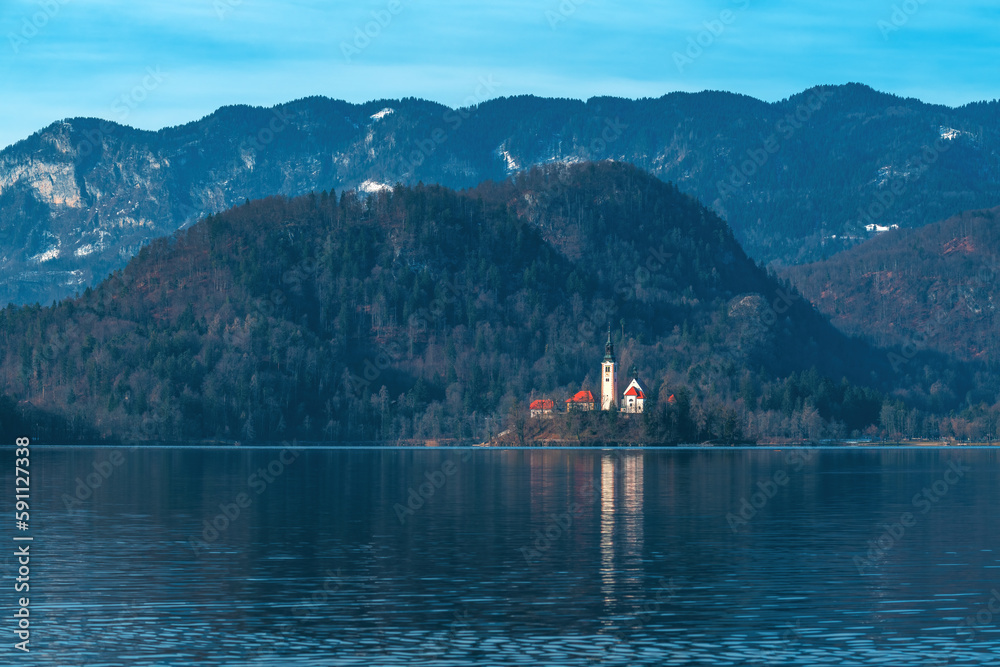 Lake Bled in cold february morning with famous landmark, the Assumption of Maria Church in background Lake Bled in cold february morning with famous landmark, the Assumption of Maria Church in background