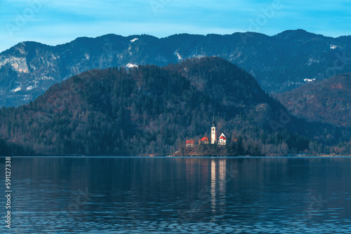Lake Bled in cold february morning with famous landmark, the Assumption of Maria Church in background