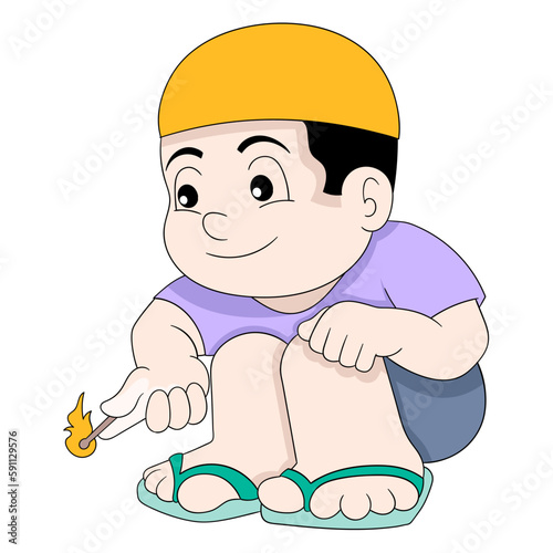 boy is sitting playing with matches