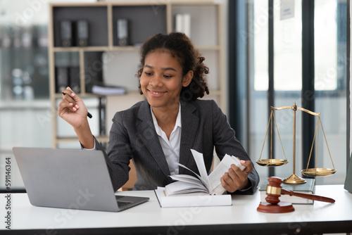Lawyers Asiawoman   having through online Concepts  of Legal services at the law office. photo