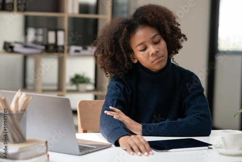 Asian woman sitting stressed with being an office worker