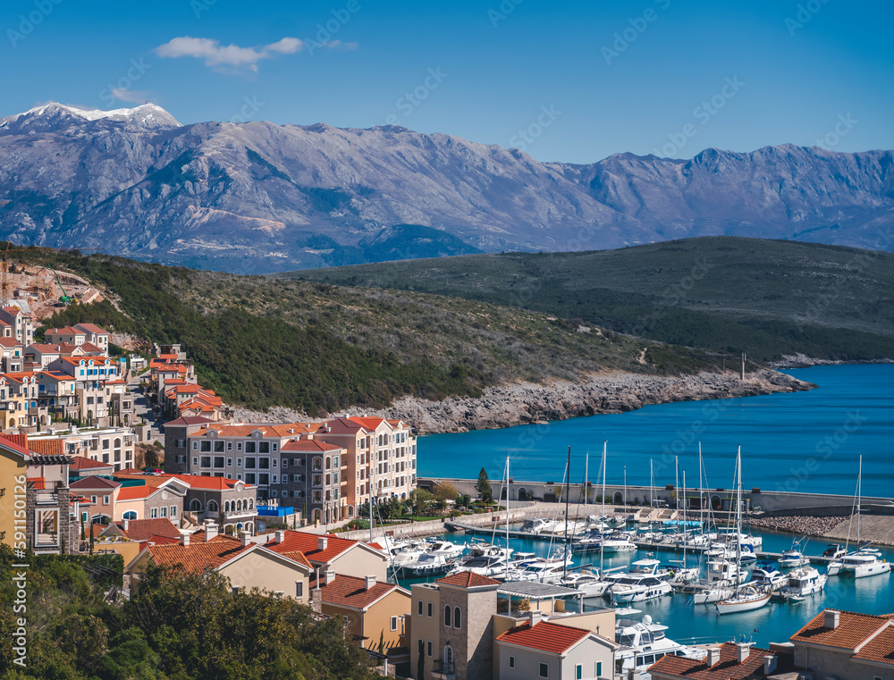 Lustica bay in Montenegro on the Adriatic coast, view of the city and the marina with yachts. Popular summer holiday destinations