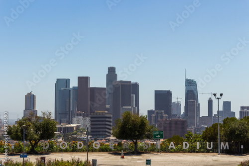 Los Angeles, California, USA, June 21, 2022: Dodger Stadium letters with LA Downtown in the background.
