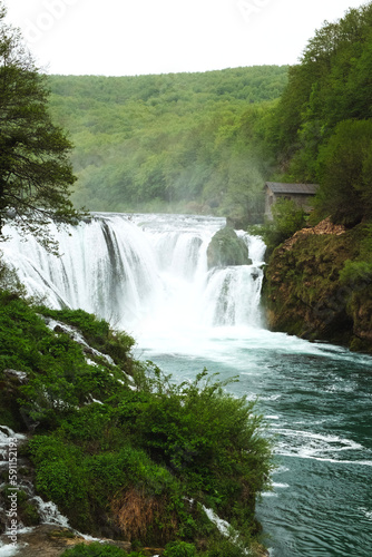 The beautiful landscape of Bosnian nature with a cascade waterfall in the National park Una in Bosnia and Herzegovina in spring
