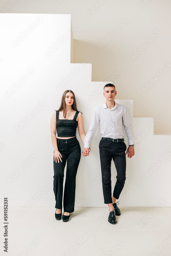 Fototapeta premium Young couple girl and boy in the studio modern lifestyle portrait. Love and relationship